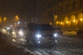 Winter snow storm. Traffic jam at night. Car blurred at the street. Royalty Free Stock Photo