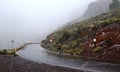 Winter snowfall in Teide National Park, Tenerife, Canary Islands, Spain.Biking on the road through snowy volcanic landscape.