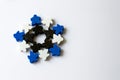 winter snowflake made of meeples - components of strategy board game on white background with copyspace Royalty Free Stock Photo