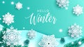 Winter snowflakes vector background design. Hello winter greeting text with snow flakes paper art decoration and leaves elements. Royalty Free Stock Photo