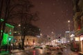 Winter, snowing, city center at night