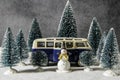 Winter snowman figurine and VW bus in snow