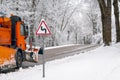 Winter - snowplow removing snow from a road