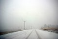 Winter snowstorm and fog makes driving hazardous Royalty Free Stock Photo