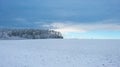 Winter snowy landscape with blue beautiful sky.Snowy forest under blue clouds. Winter weather.Winter frosty wallpaper Royalty Free Stock Photo