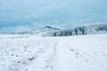 Winter snowy landscape with blue beautiful sky.Snowy mountain and forest under blue clouds. Winter weather.Winter frosty Royalty Free Stock Photo