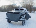 In the winter on a snowy road, a German armored car