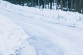 Winter snowy road. Tractor cleared road in winter Royalty Free Stock Photo