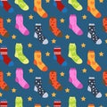 Winter socks with different prints seamless pattern. Christmas sock repeating texture. Endless background. Vector