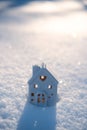 Winter solstice in snowy forest or park natural scene. Hibernal solstice. Toy house and Sparkling snow in the snowy Royalty Free Stock Photo