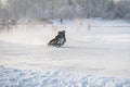 Winter Speedway. Racers unmarked drive on the ice road