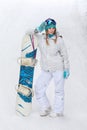 Winter, sport concept, happy young woman with snowboard outdoors Royalty Free Stock Photo