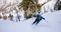 Winter sport: man skiing in powder snow. Royalty Free Stock Photo