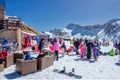 Winter sports and entertainment activity for skiers and snowboarders. Many people chill out apres ski relaxing open air Royalty Free Stock Photo