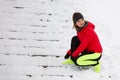 Woman tying sport shoes during winter