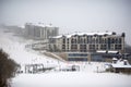 winter sports resort, with skiers and snowboarders taking advantage of the slopes