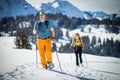 Two friends hiking with snowshoes in high mountains Royalty Free Stock Photo