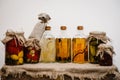 Winter stocks home canned food in glass jars. life in retro, rustic style on the background gift box is packed in sackcloth. Royalty Free Stock Photo