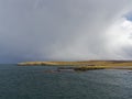 A Winter Storm coming in from the North over the tip of the Isle of Bressay in the Shetland Islands. Royalty Free Stock Photo