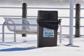 Winter Storm, garbage can on a bridge.