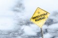 Winter Storm Warning Sign With Snowfall and Stormy Background Royalty Free Stock Photo