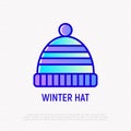 Winter striped hat with pompon thin line icon. Modern vector illustration