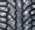 Winter studded tire background. Winter car tires texture background with snow. Tire stack background. Tyre protector surface. Royalty Free Stock Photo