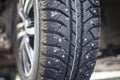 Winter studded tires on car, selective focus Royalty Free Stock Photo