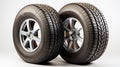 Winter and summer auto tires. A pair of tires. Wheels of vehicles stacked up. lone automobile tires on a white background.