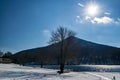 Winter Sun Over Sharp Top Mountain Royalty Free Stock Photo