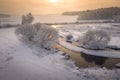 Winter sunrise. Beautiful winter scene on river in frosty morning. Aerial view of winter nature. Snowy landscape from above Royalty Free Stock Photo