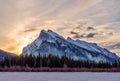 Winter sunrise over frozen Vermilion Lakes covered in snow at Banff National Park Royalty Free Stock Photo