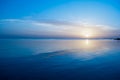 Winter sunrise on red sea. Blue sky and calm water on sunrise time. The cold sun morning. The sun under the sea blue water Royalty Free Stock Photo