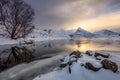 Winter Sunrise with sun reflection on water Royalty Free Stock Photo