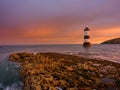 Winter sunrise on Trwyn Du Lighthouse at Penmon Point, Anglesey, Wales