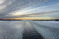 Winter sunset. Beautiful view of the northern snow covered Baltic sea at sunset time in winter. Royalty Free Stock Photo