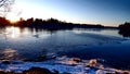 Winter sunset behind a river