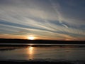 Winter sunset and sun dog on Cayuga Lake before first snowstorm Royalty Free Stock Photo