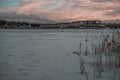 Winter sunset. Frozen Lake. Blue sky. Beautiful melancholy nature. Royalty Free Stock Photo