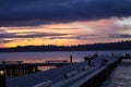 A diagonal view of a pier on a lake in a winter sunset at Waverly Beach Park, Kirkland, Washington Royalty Free Stock Photo