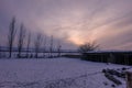 Winter sunset on a humble farmhouse