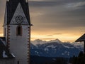 Winter sunset landscape of an old austrian church in an alps village, snowy mountains, Wallfahrtskirche Maria Schnee Matzelsdorf