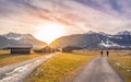 Winter sunset over alpine country roads Royalty Free Stock Photo