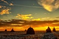 Winter sunset over a field with snow and haystacks Royalty Free Stock Photo