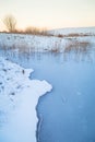 Winter Sunset Over Frozen Pond