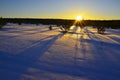 Winter sunset over snowy fields Royalty Free Stock Photo