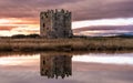 Winter sunset over Threave Castle, reflecting on the River Dee, Scotland Royalty Free Stock Photo