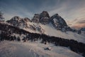 Winter sunset panorama of dolomite hut at the foots of north face of Mount Pelmo Royalty Free Stock Photo
