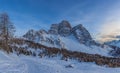 Winter sunset panorama of dolomite hut at the foots of north face of Mount Pelmo Royalty Free Stock Photo