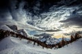 Winter sunset panorama of Mount Pelmo and Mount Civetta with dramatic colors Royalty Free Stock Photo